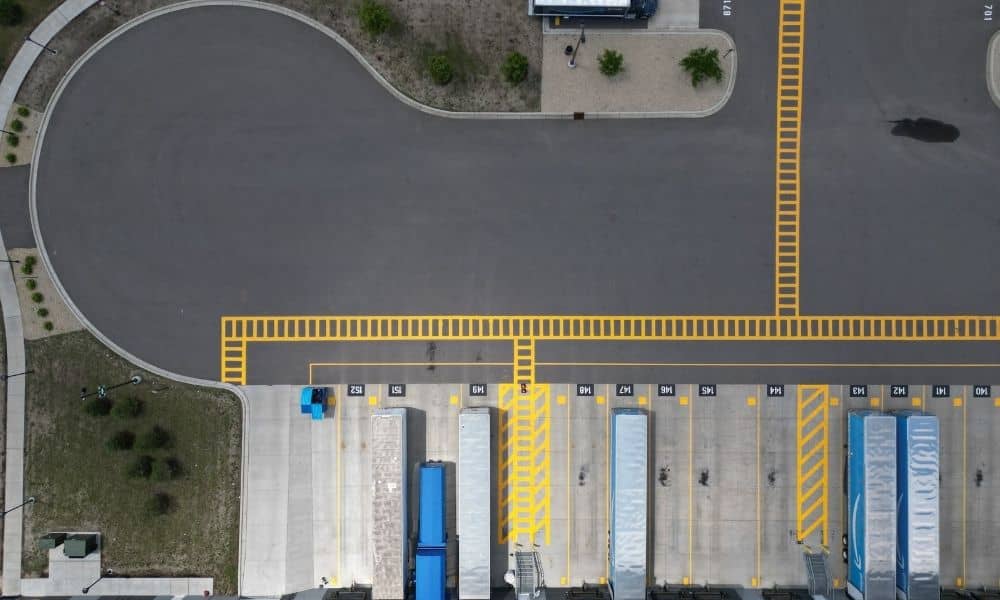 Aerial view of a warehouse loading dock and access lanes relevant to an ALTA title survey of commercial property